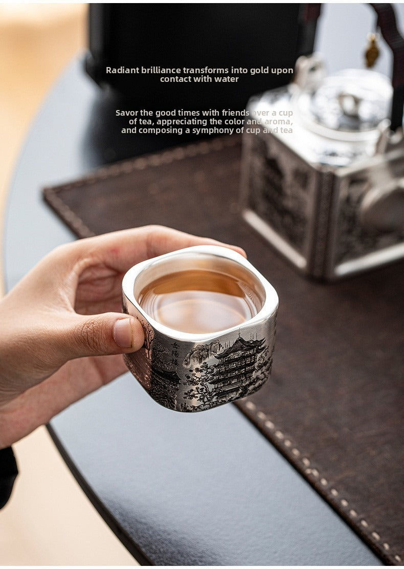 Master-crafted silver-plated Yueyang Tower Gongfu tea set (swing-handle pot and four cups)—premium home use and gift-ready.