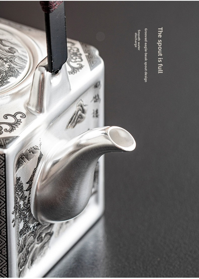 Master-crafted silver-plated Yueyang Tower Gongfu tea set (swing-handle pot and four cups)—premium home use and gift-ready.