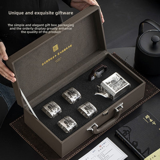 Master-crafted silver-plated Yueyang Tower Gongfu tea set (swing-handle pot and four cups)—premium home use and gift-ready.