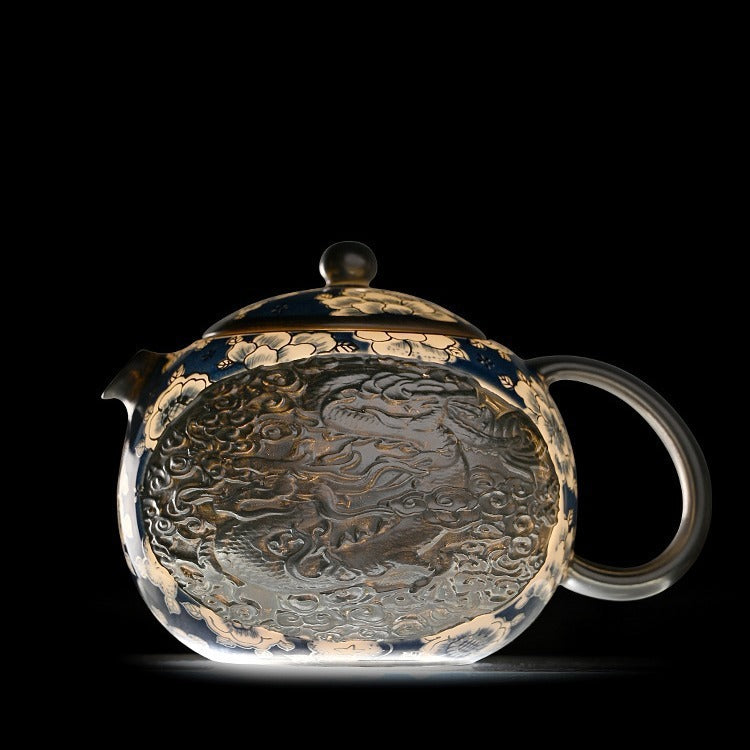 Handcrafted silver "Xishi" style teapot featuring dragon and phoenix relief, blue-and-white accents, and silver gilding; a premium Gongfu tea vessel for home use.
