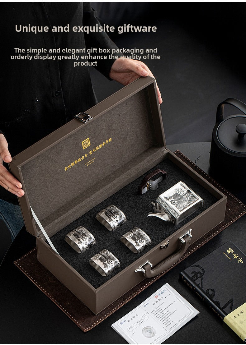 Master-crafted silver-plated Yueyang Tower Gongfu tea set (swing-handle pot and four cups)—premium home use and gift-ready.