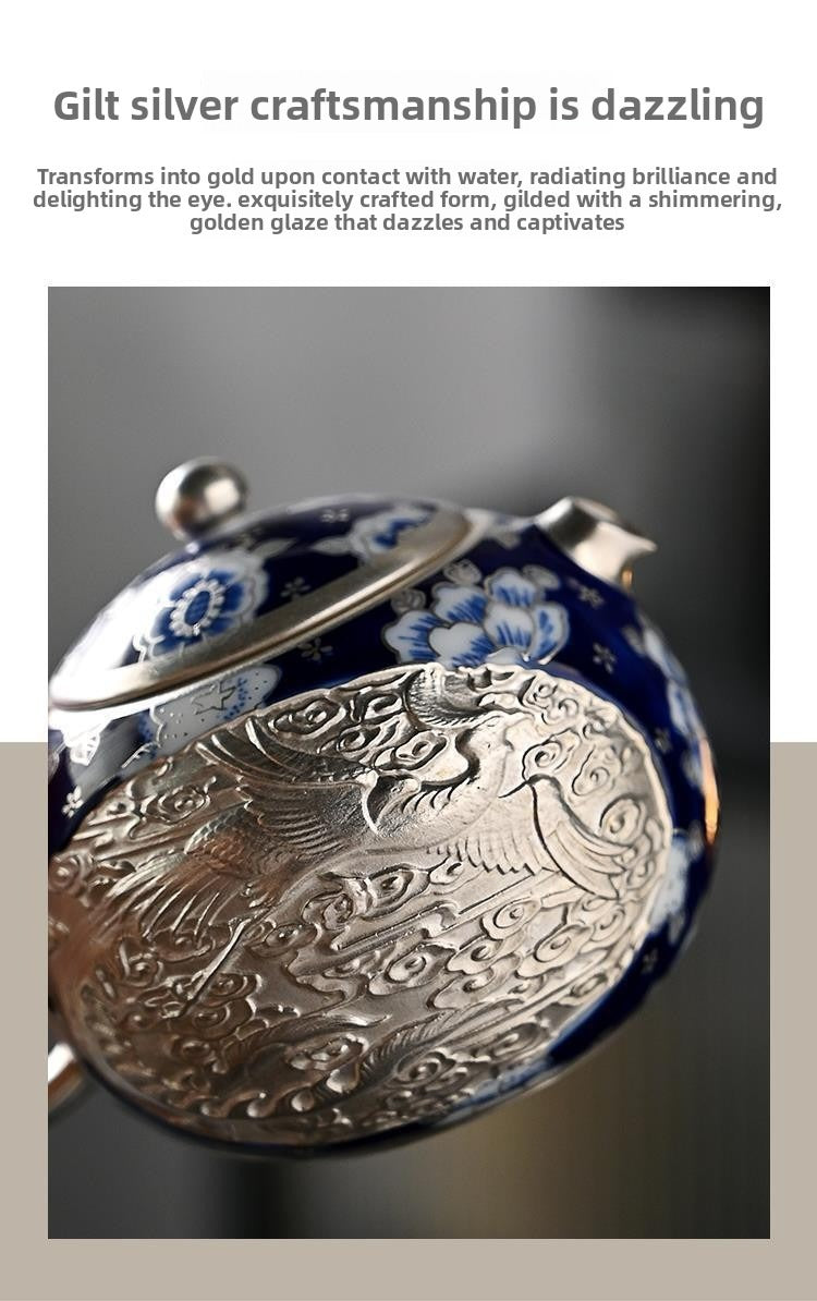 Handcrafted silver "Xishi" style teapot featuring dragon and phoenix relief, blue-and-white accents, and silver gilding; a premium Gongfu tea vessel for home use.